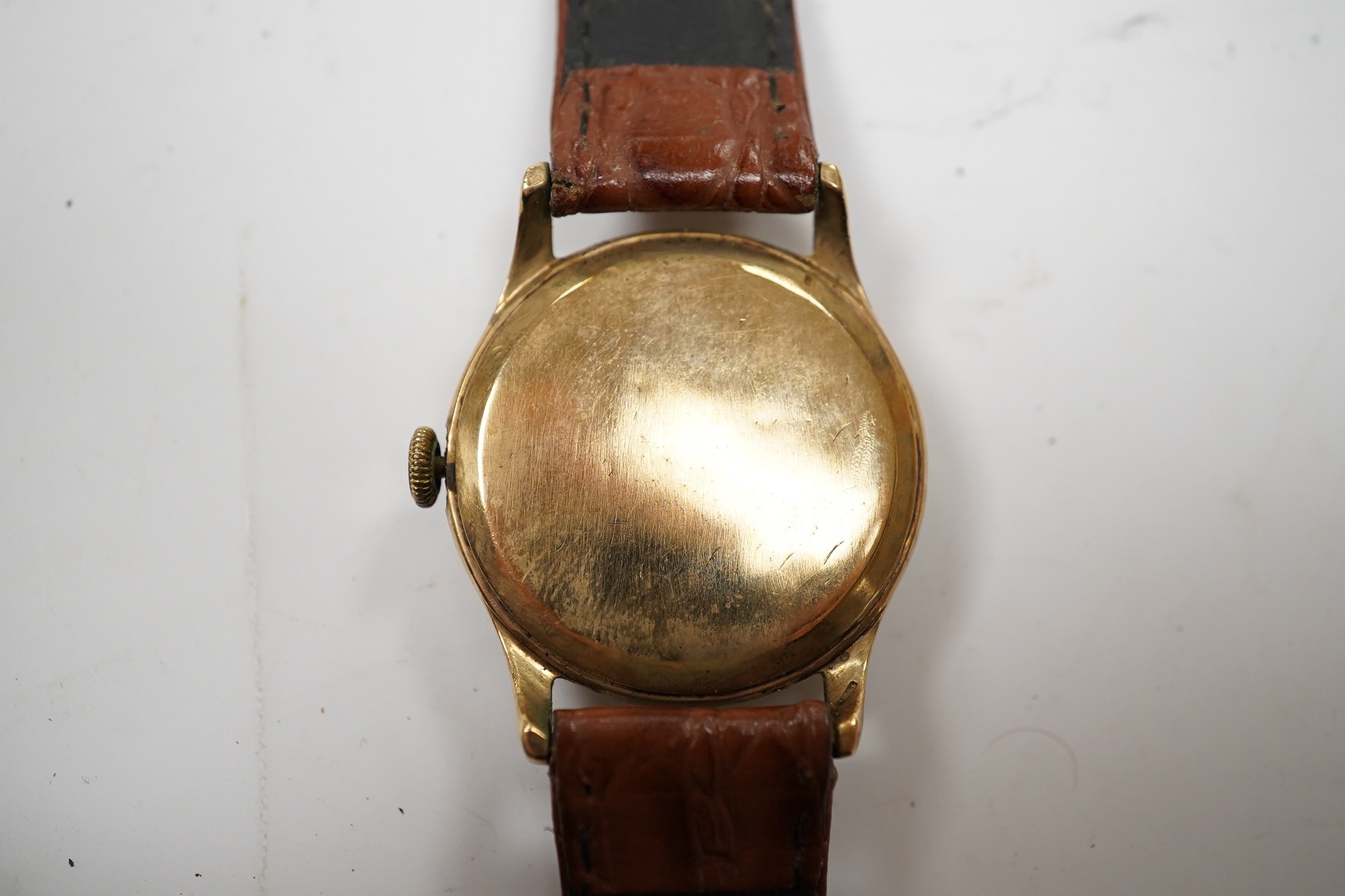 A gentleman's 9ct gold Vertex Revue manual wind wrist watch, case diameter 32mm, on a leather strap. Condition - poor to fair